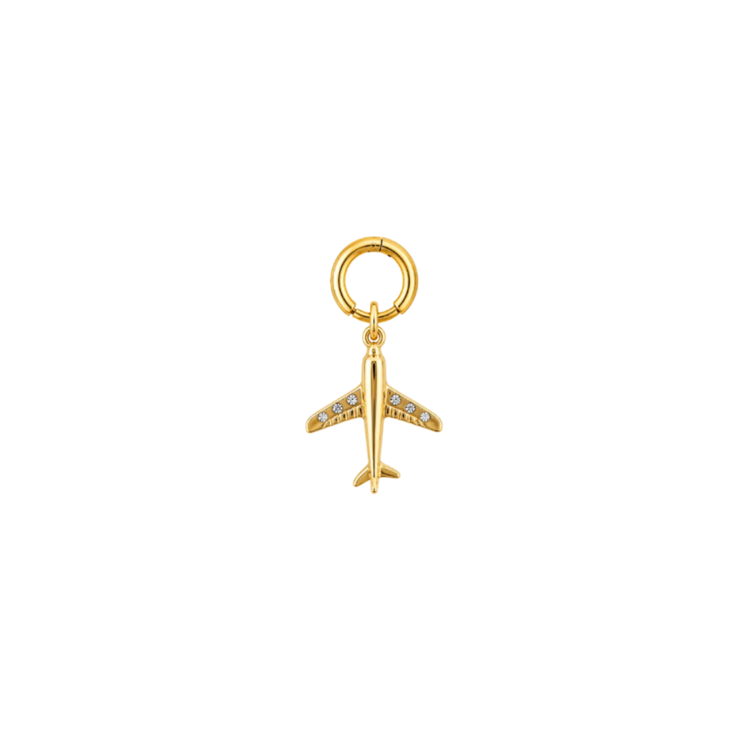 A gold airplane charm pendant with small clear stones set along the wings, hanging from a gold ring on a plain white background.
